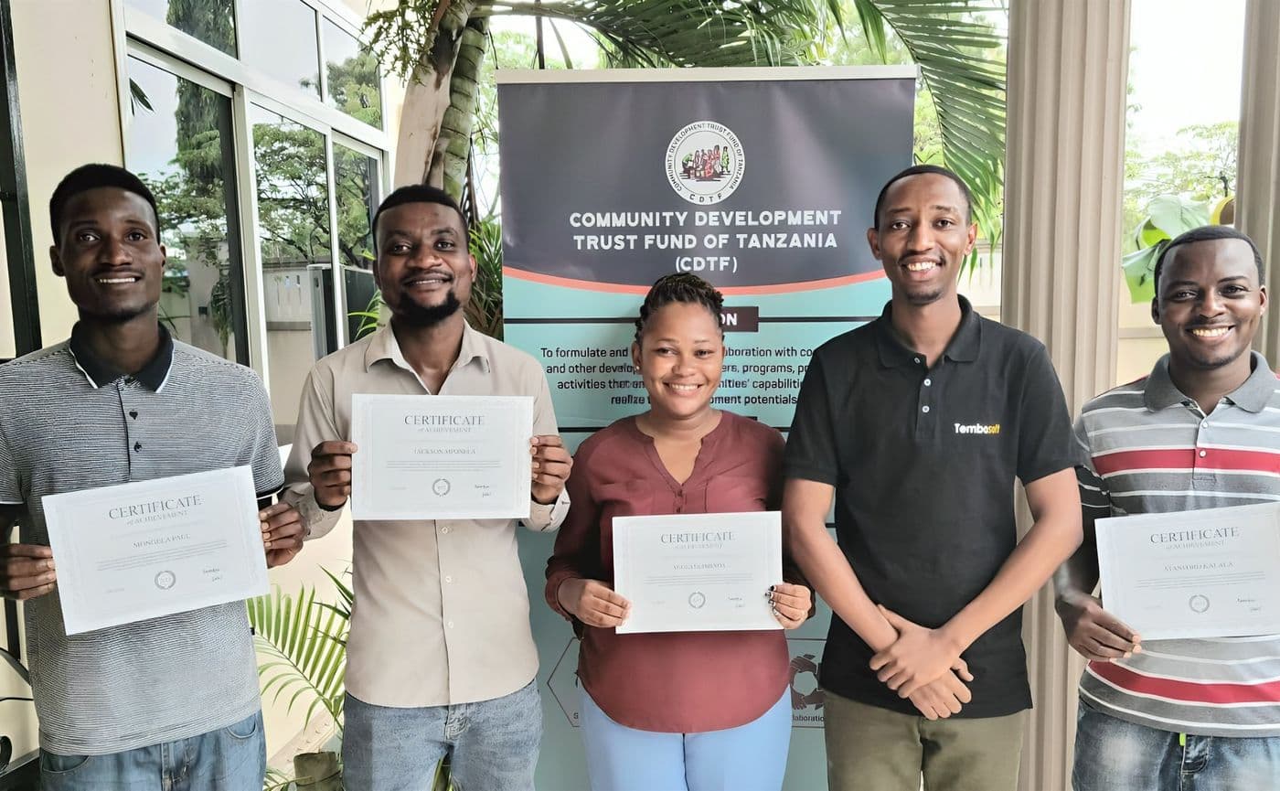 CDTF team members holding certificates of achievement after the Tembosoft implementation